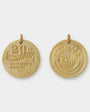 Two gold travel-themed pendants on a white background