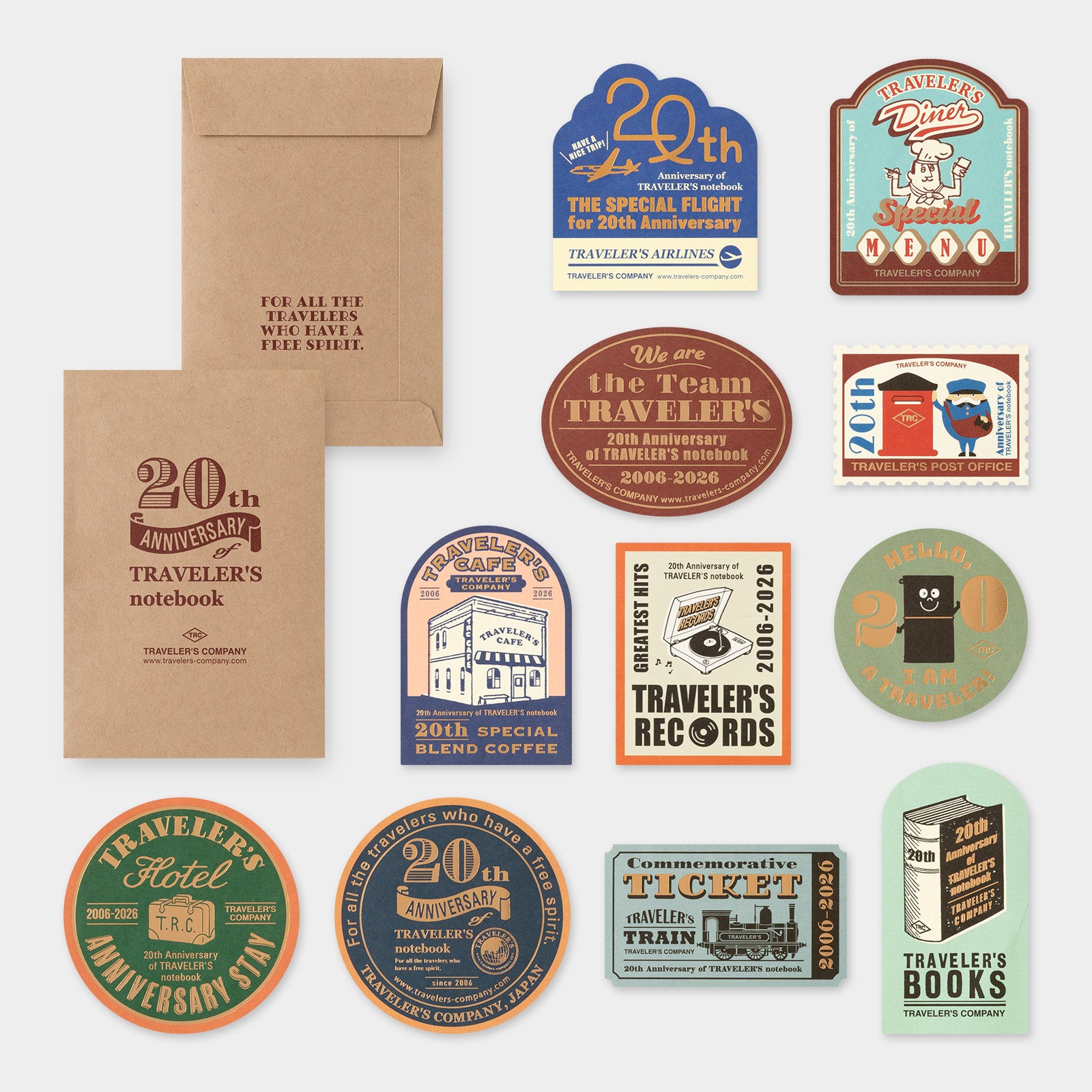 Collection of travel-themed stickers and notebook on a white background