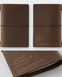 Brown leather notebook with '20th Traveller's' branding on a white background