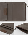 Brown fabric wallet with zipper on a white background