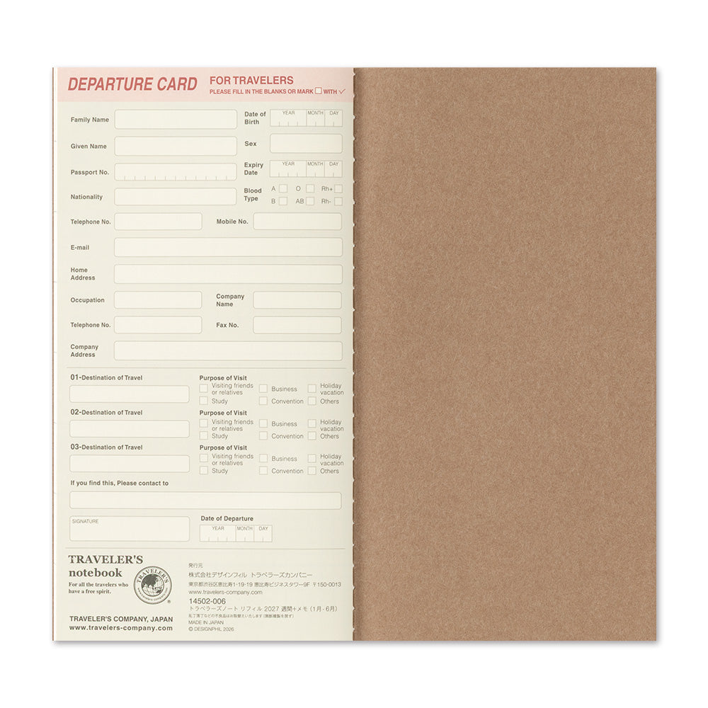 A traveler's departure card notebook shown open, with a tan paper cover and a printed departure card page inside. The card has fields for traveler details and destinations, with the brand name Traveler's Notebook visible at the bottom.
