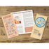 Three printed booklet pages for a traveler's notebook laid out on a rustic wooden surface. The pages include illustrated covers and text sections, including one peach-colored guide page, one cream text page, and one kraft-paper style page with a blue circular design.