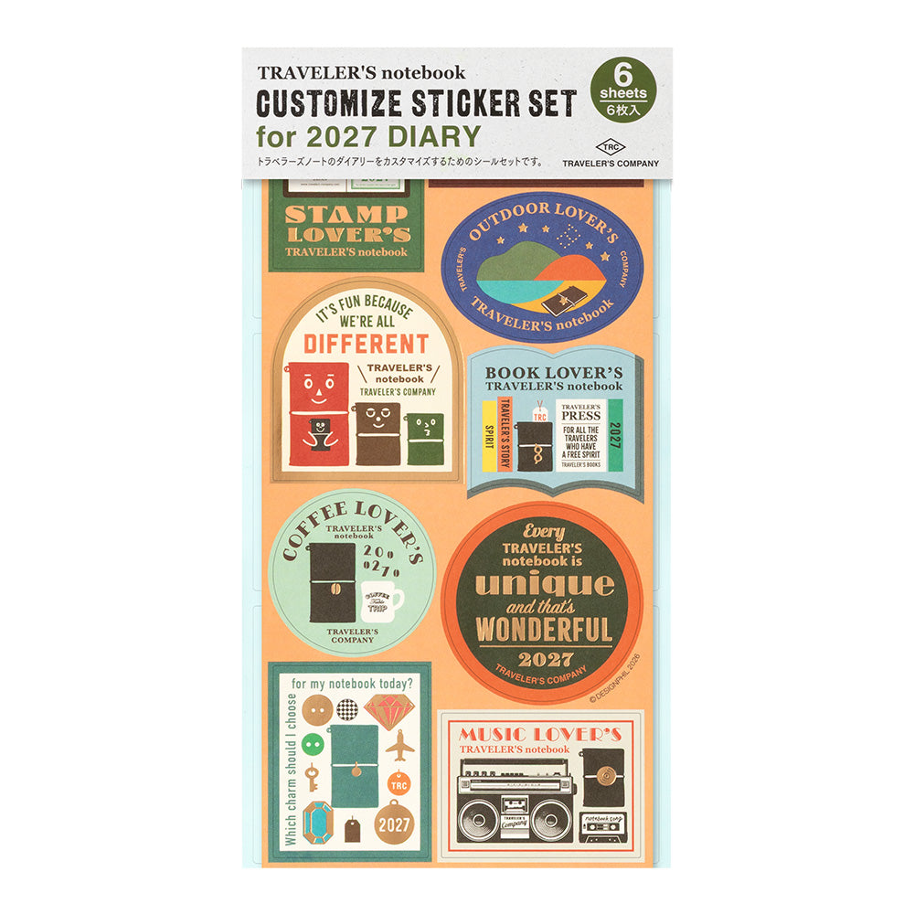 A package of six customizable stickers for a 2027 diary/traveler's notebook, featuring retro-style circular and rectangular labels with travel-themed phrases and illustrations on a light gray background.