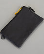 Black drawstring pouch on a gray background