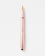 Rose gold fountain pen on a white background