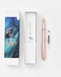 Rose gold pen with a decorative box on a white background