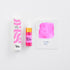 Pink ink bottle with packaging and color swatch on a white background