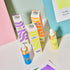 Colorful ink tubes and boxes on a pastel background