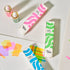Colorful ink bottles and boxes on a light background