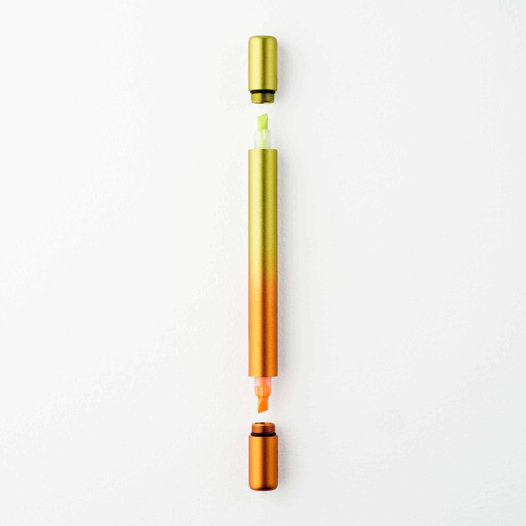 Two gradient-colored pens, one gold to green and the other gold to orange, on a white background.