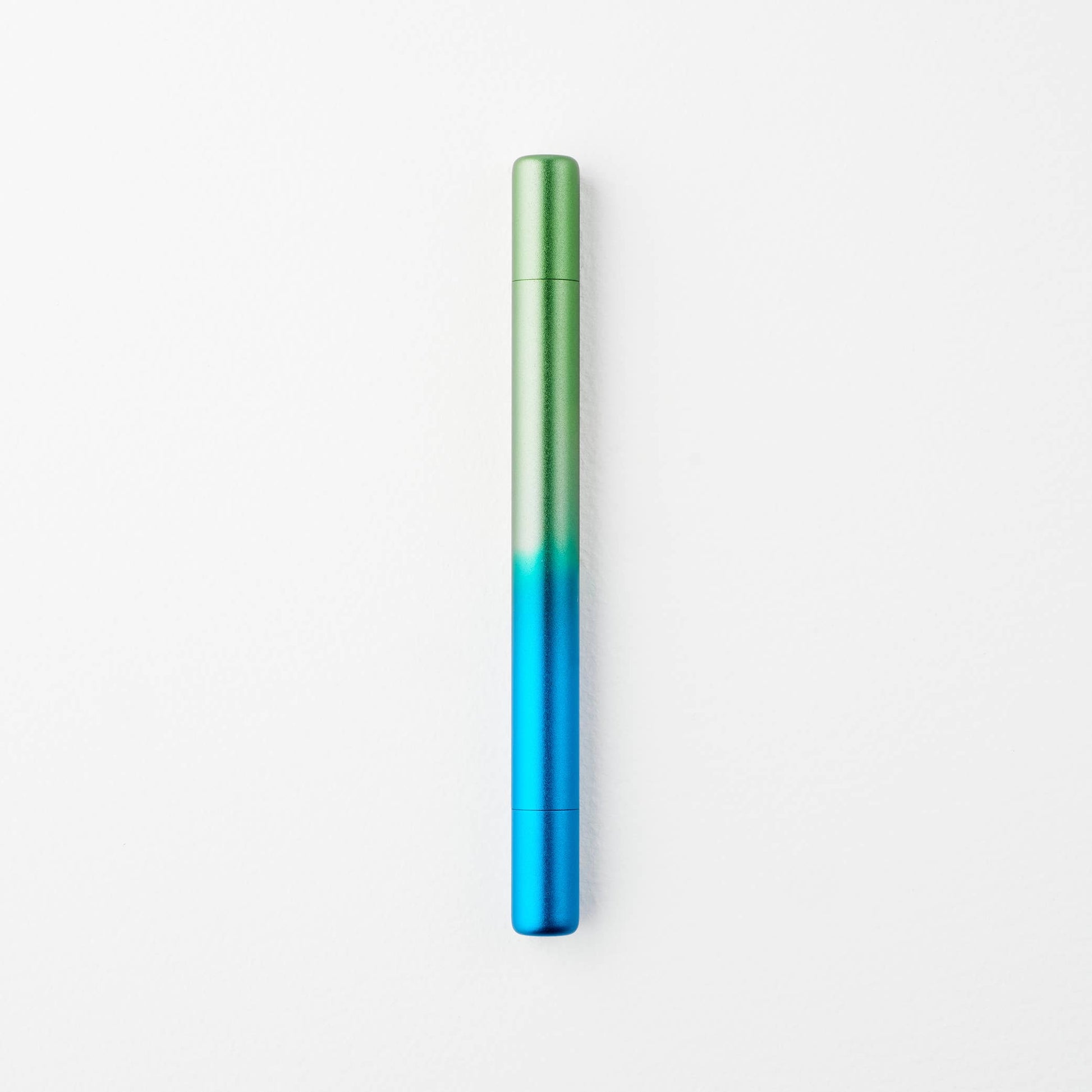 Gradient blue to green cylindrical object on a white background