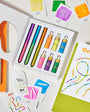 Colorful highlighter set with packaging and cards on a white background