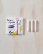 Toni's Studio highlighter tip packaging with three white tips on a wooden surface