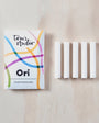 Toni's Studio Ori spare reservoirs packaging with white strips on a light wooden surface