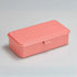 Rectangular pink plastic box on a gray background