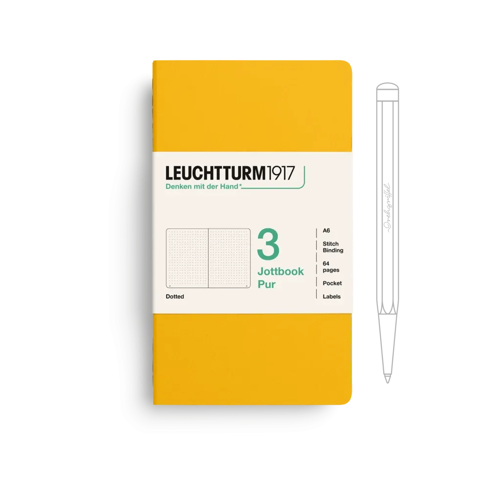 Yellow notebook with white label and pen on a white background