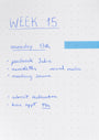 Weekly planner with tasks listed for Week 15 on a dot grid notebook.