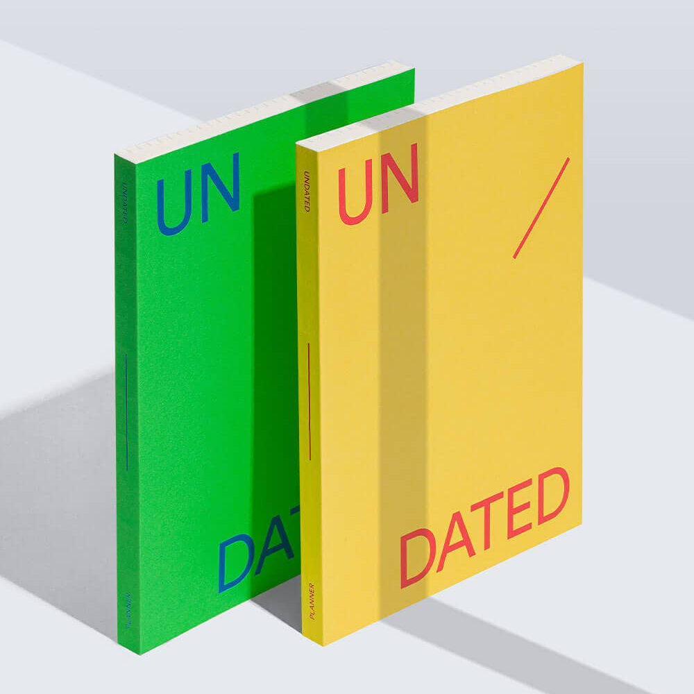Two books, one green and one yellow, with 'UNDATED' text on a white background.