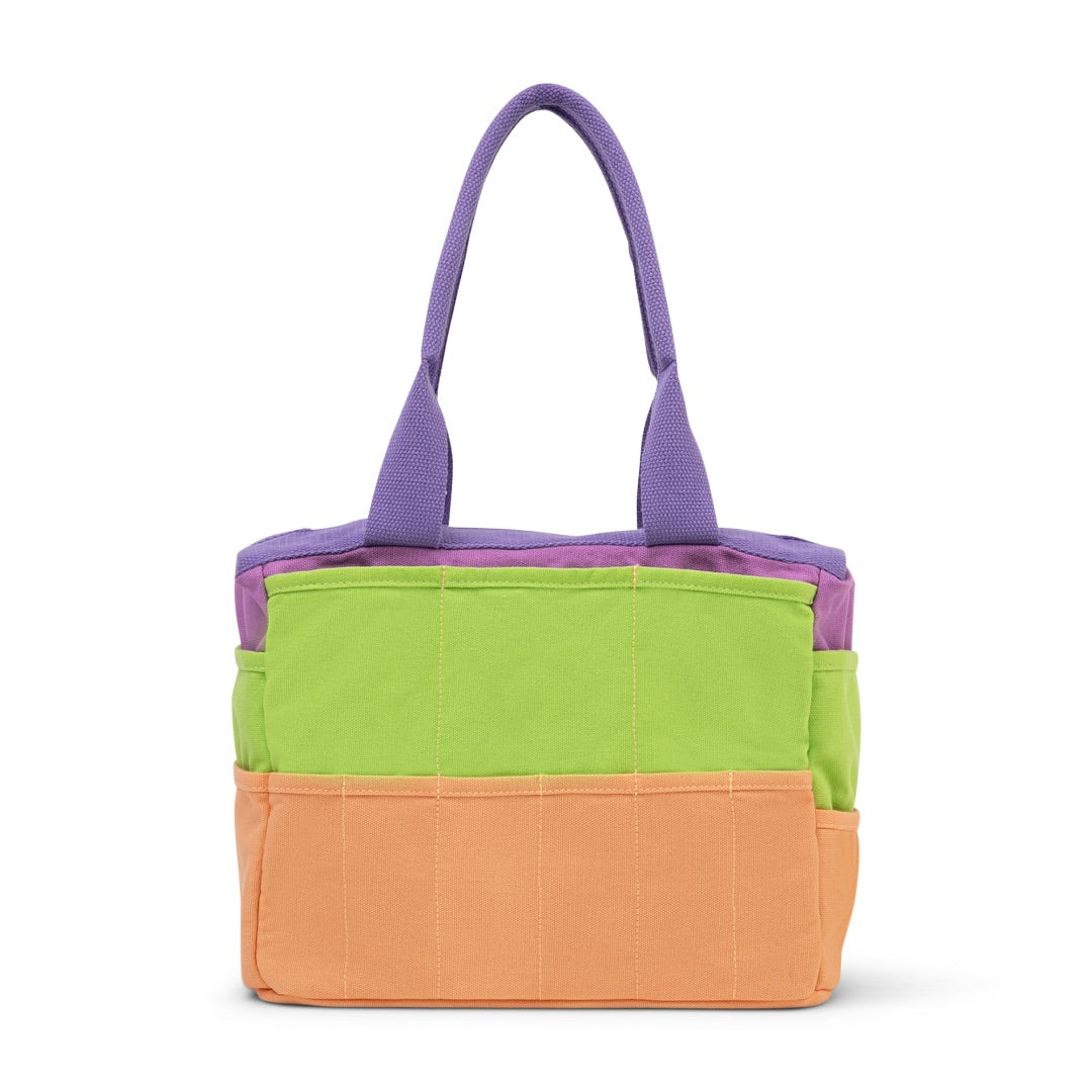 Colorful tote bag with purple handle on a white background
