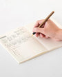MD paper notebook A5 man writing with pen